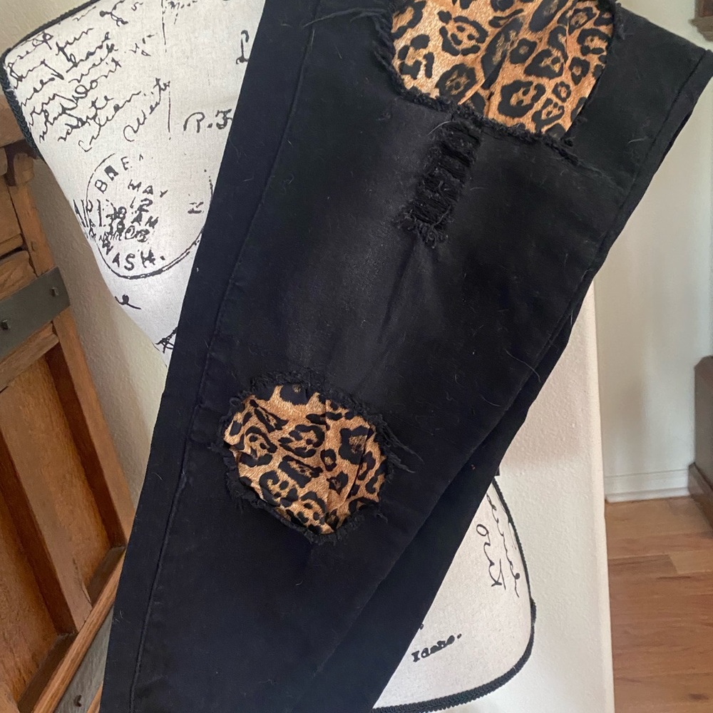 L&B size 20. Black distressed jean with leopard patches.